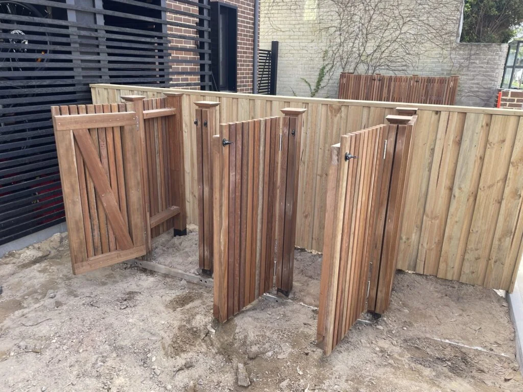Spotted gum wheelie bin enclosures on both sides of a Bronte duplex