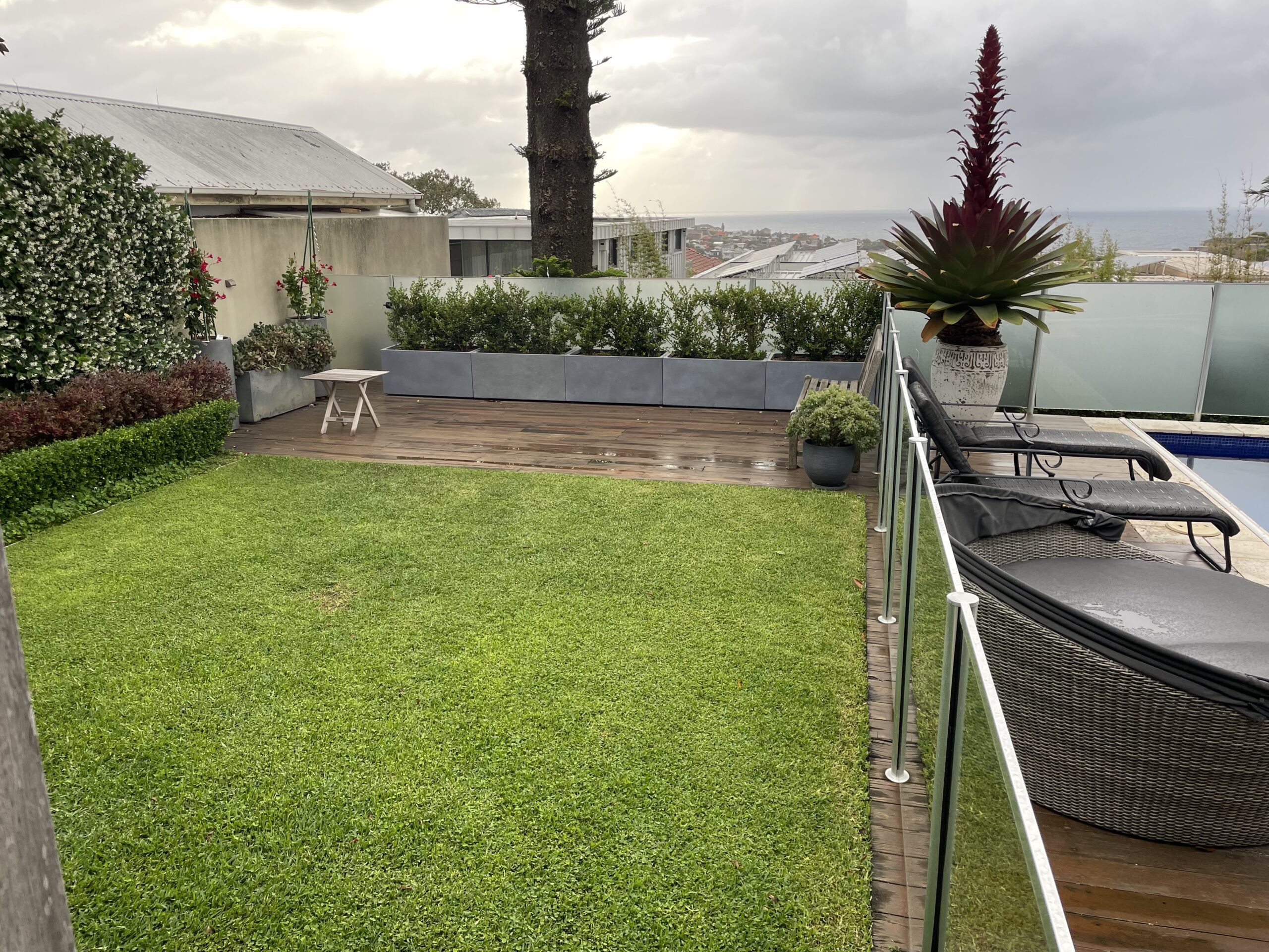 Clovelly pool area before Millboard deck build — The Decksmith