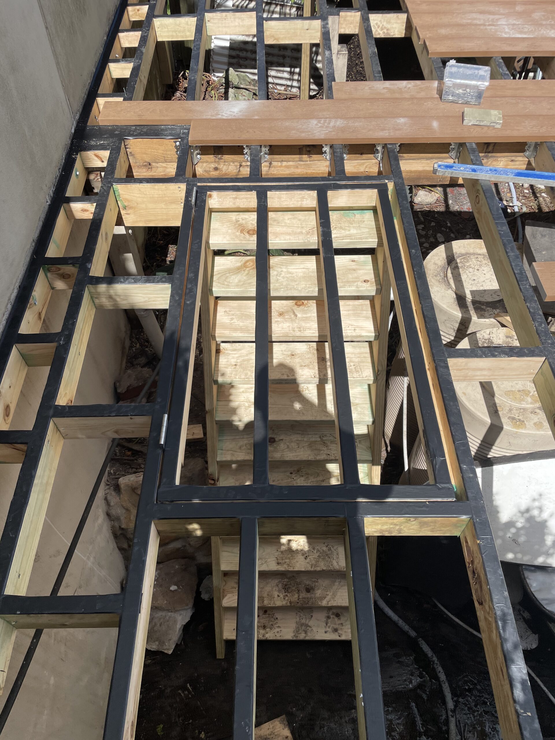 Concealed trap door closed in the decking, Clovelly pool deck — The Decksmith