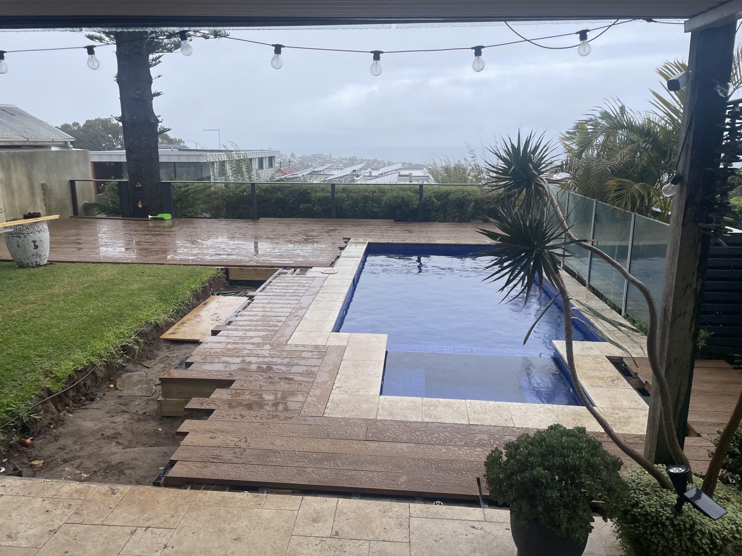 Site cleaned by overnight rain during build, Clovelly pool deck — The Decksmith
