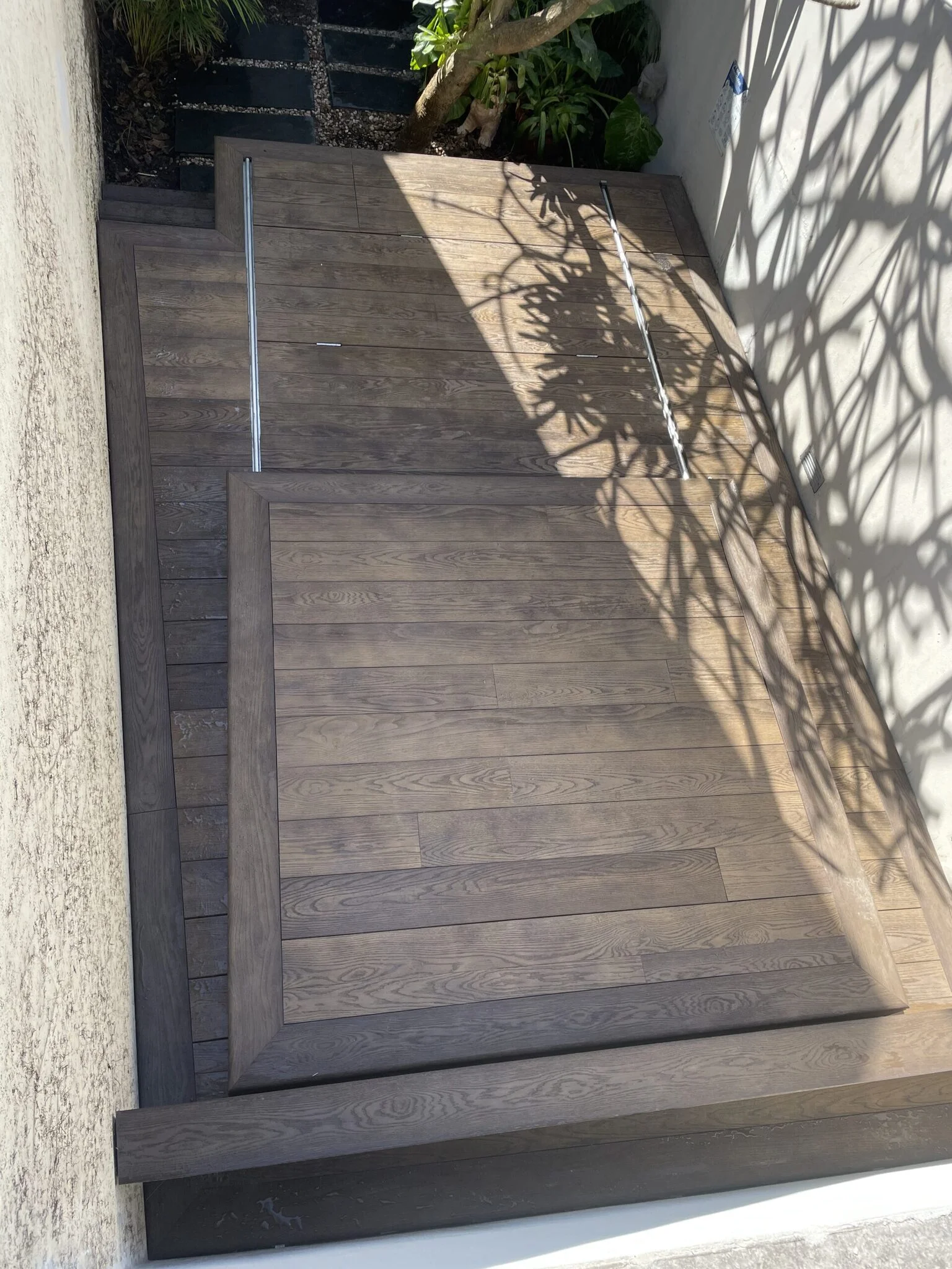 Millboard Lowdeck sliding pool cover final closed deck position — low-clearance spa deck in Paddington