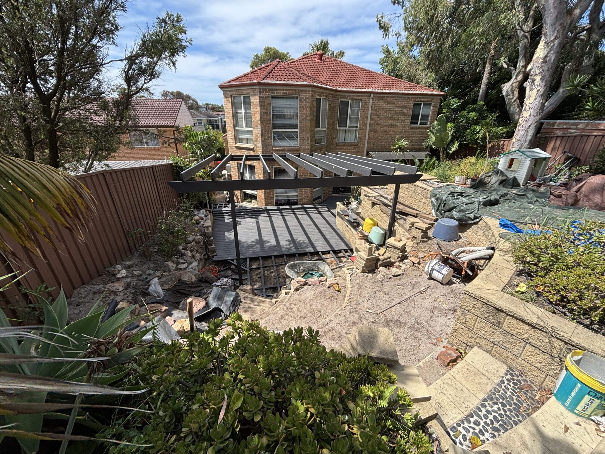 NI Chifley Clickdeck EzGlaze and WoodEvo Decking and pergola progress — Clickdeck aluminium garden deck in Chifley