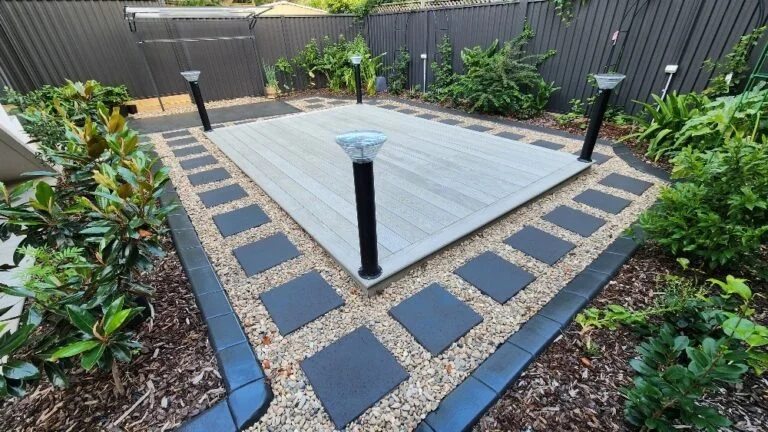 Millboard Smoked Oak deck with paver border at Maroubra