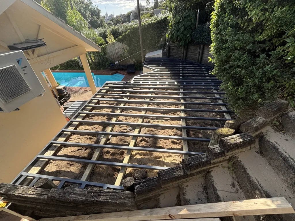 LowDeck H4 deck frame following the curve of the retaining wall in Double Bay
