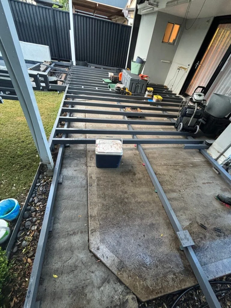 Framing begins — treated pine sub-structure in Kingsford