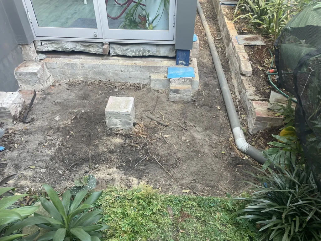 Ground cleared under the old deck at Kyogle Street Maroubra showing the existing brick piers kept for reuse
