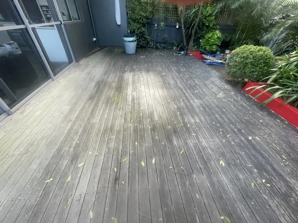 The old timber deck at Kyogle Street Maroubra before replacement, boards weathered and grey