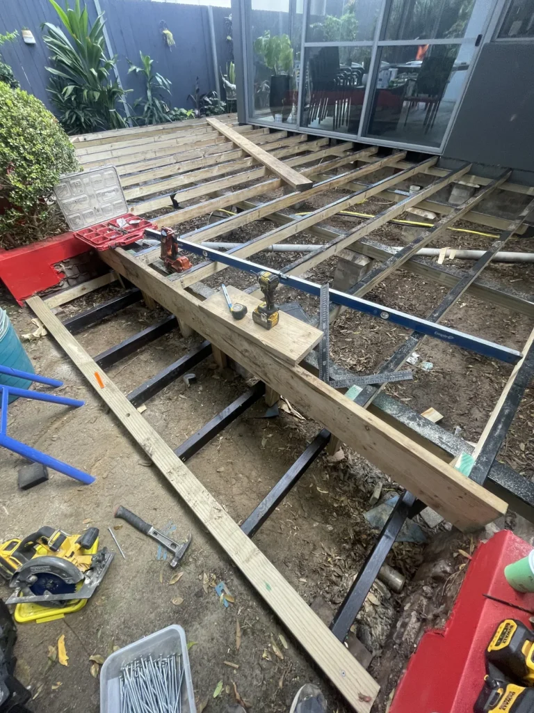Joist protection running along every joist of the H3 treated pine frame in Maroubra, levelled before decking