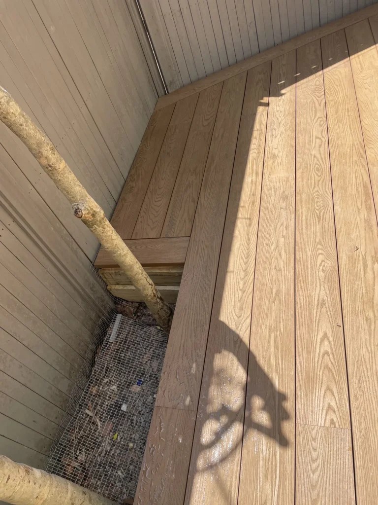 Tree trunk through a cut-out in the Millboard, Rose Bay