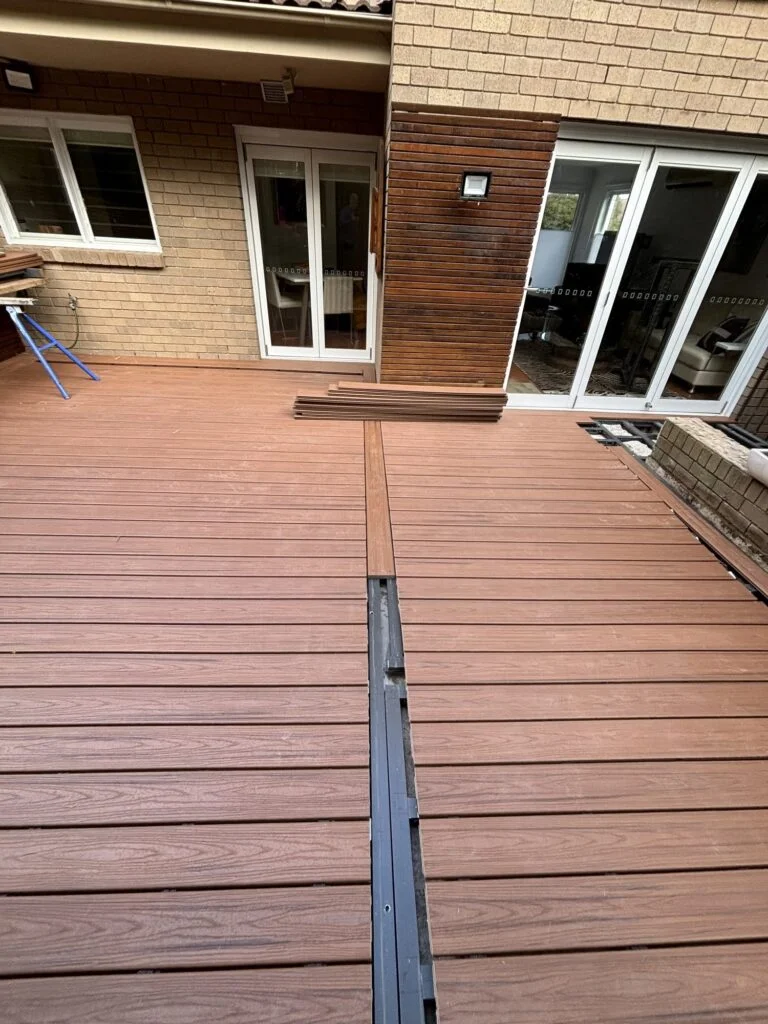 Trex Transcend Tiki Torch breaker board being installed on ClickDeck aluminium frame, Neutral Bay